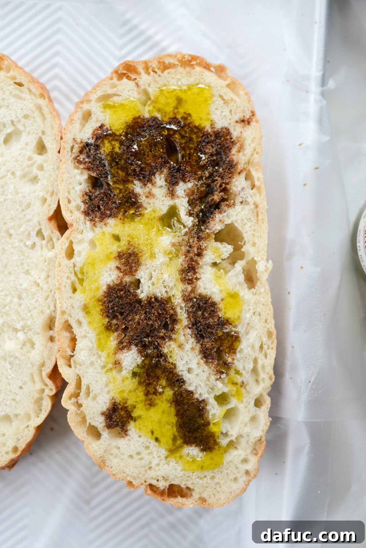 Pressed Italian Perfection 6 Balsamic vinegar and olive oil drizzled on one side of the bread.