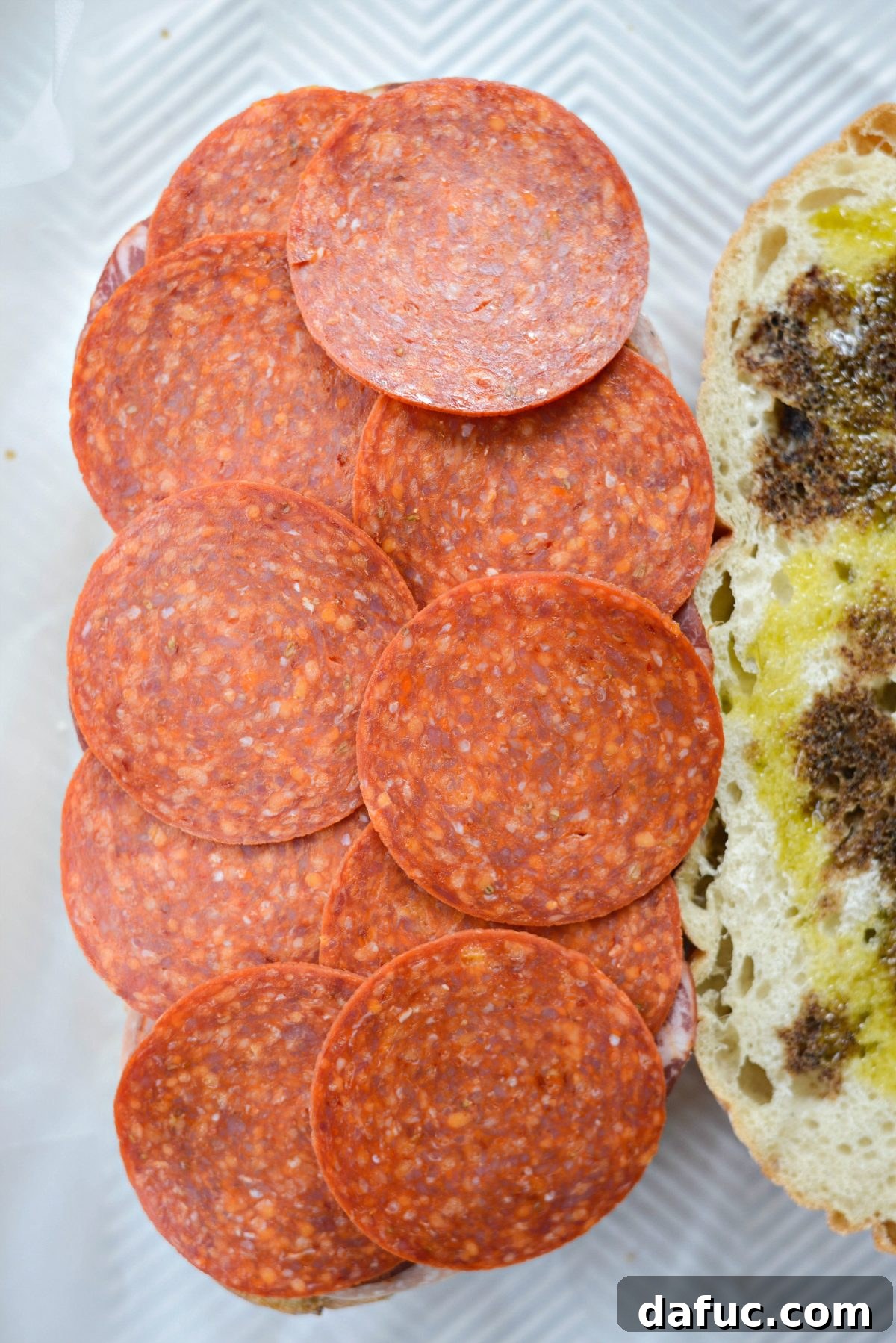Pressed Italian Perfection 10 Layer sandwich pepperoni slices.