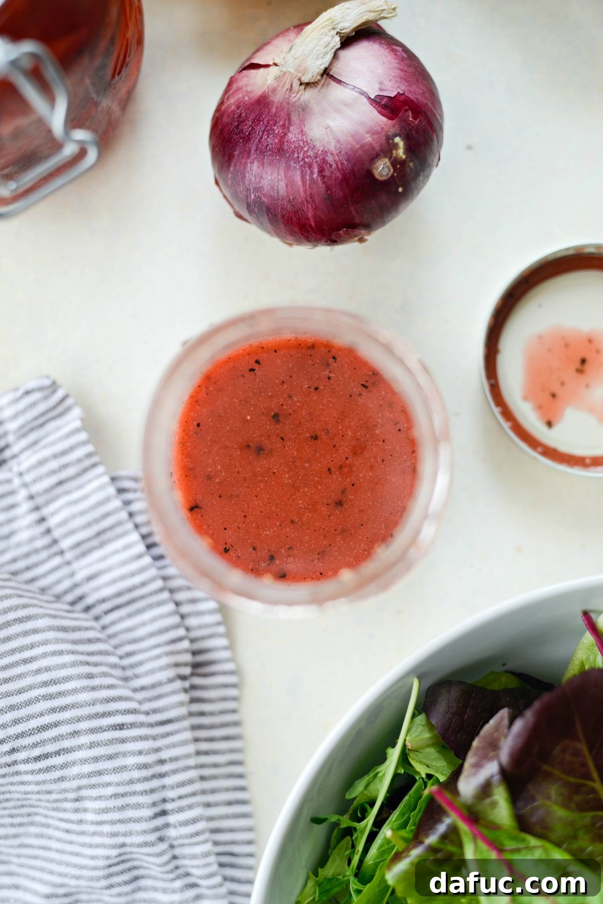 Detailed close-up of Strawberry Peppercorn Vinaigrette, highlighting its texture and color.