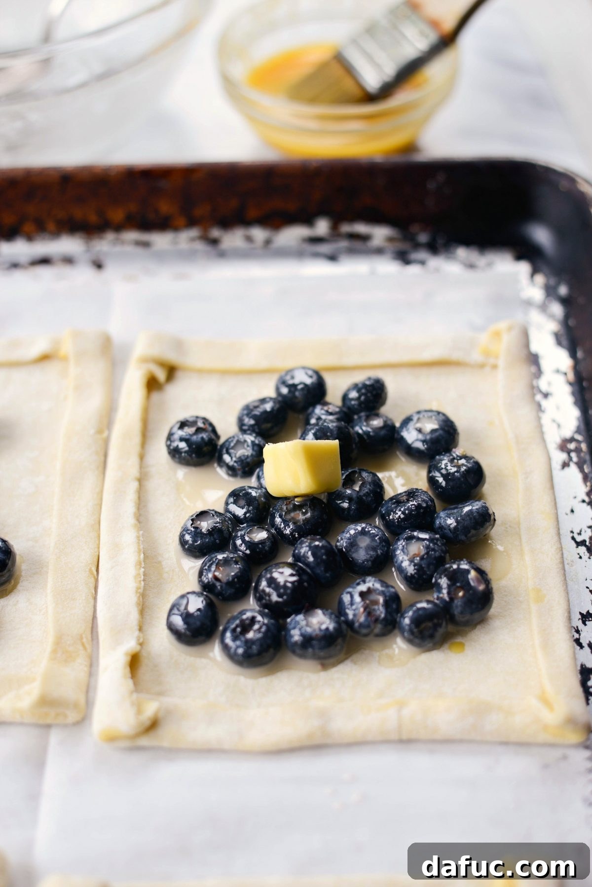 Lavender Blueberry Hand Pies 14 divide blueberries among puff pastry squares and dot with butter