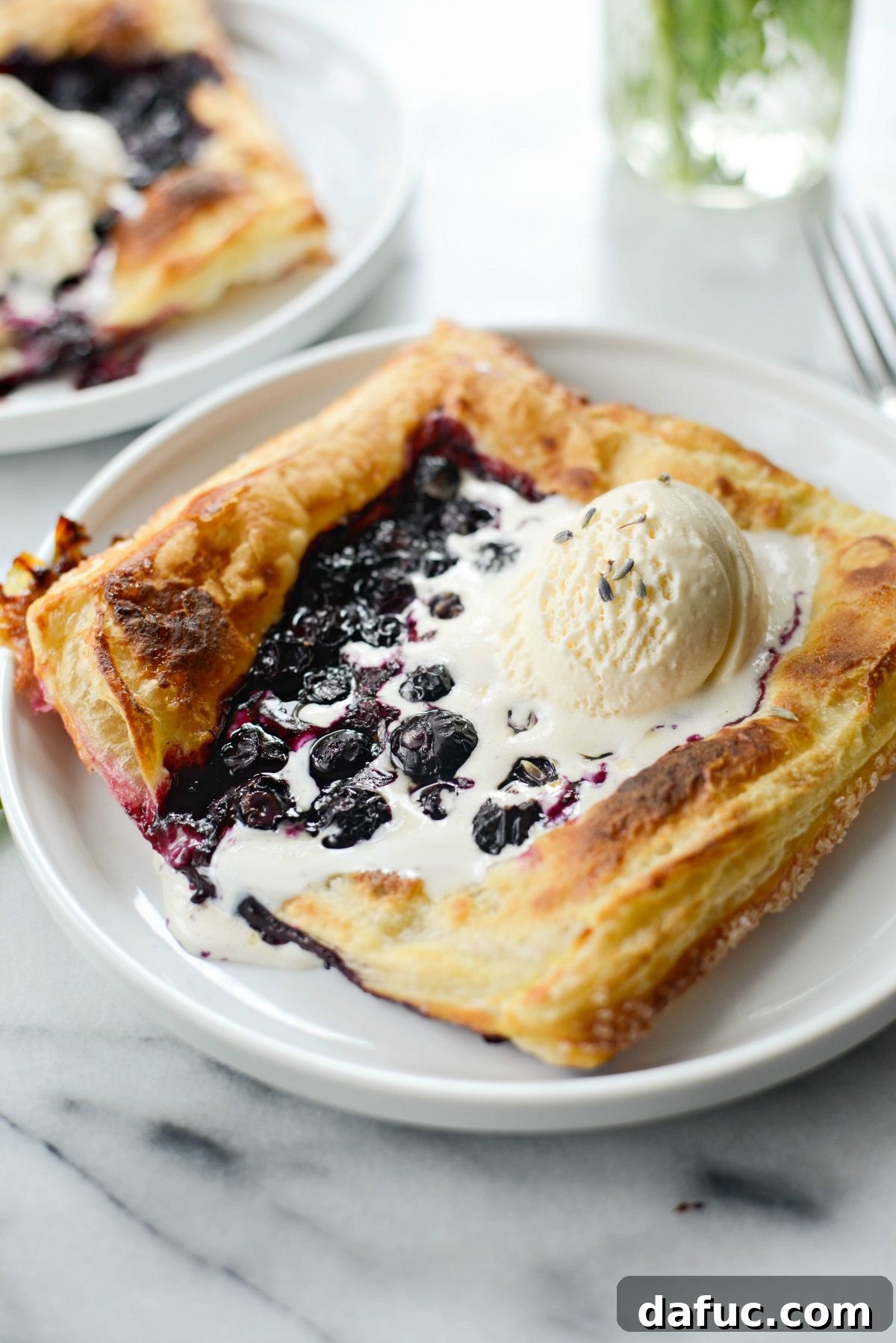 Blueberry Lavender Pastry Pies on white plates