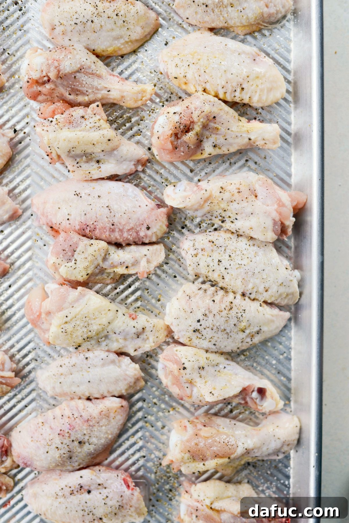 Sweet & Smoky Cherry Chipotle Wings 12 Spraying chicken wings with olive oil and seasoning them with salt and pepper