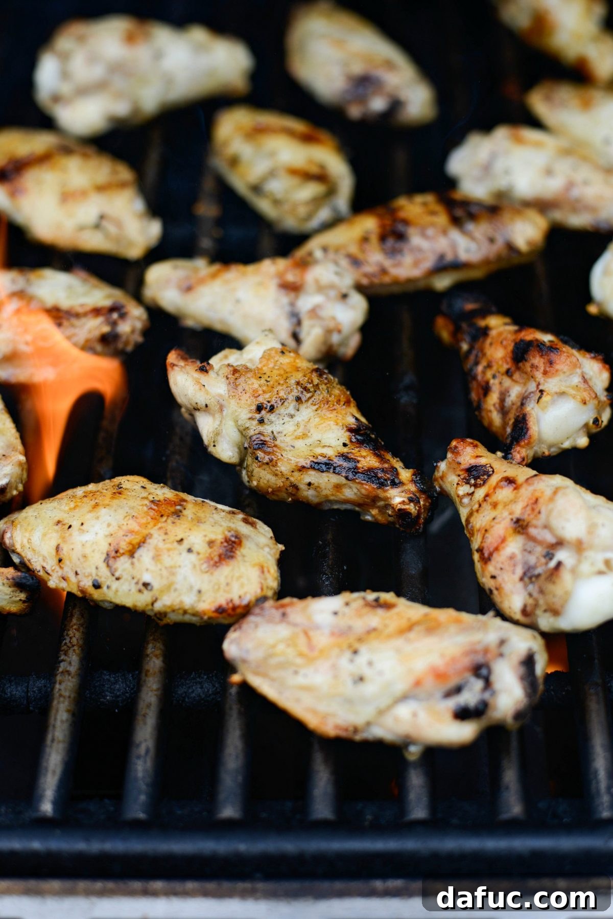 Sweet & Smoky Cherry Chipotle Wings 13 Placing seasoned chicken wings directly onto the preheated grill grates