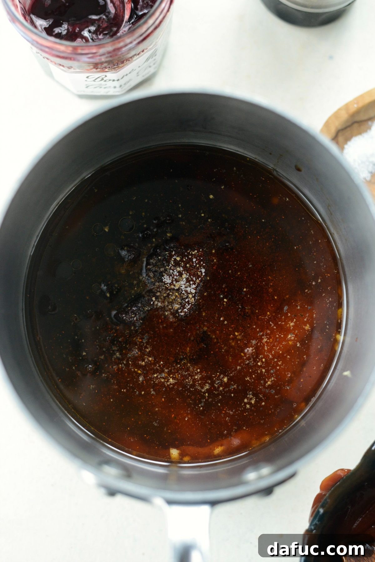 Sweet & Smoky Cherry Chipotle Wings 7 Adding cherry preserves, apple cider vinegar, chipotle powder, Worcestershire sauce, salt, and pepper to the sauce mixture