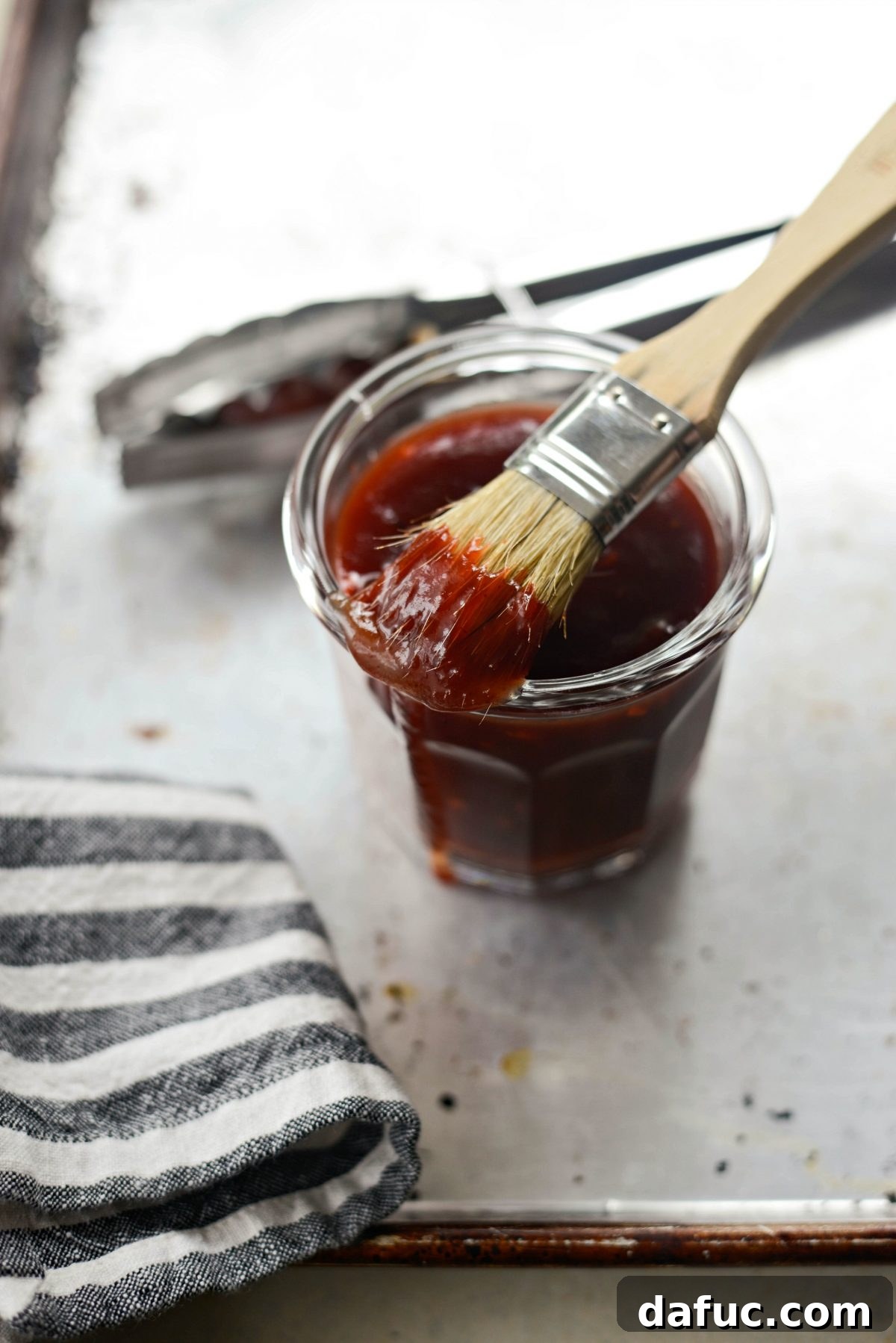 Sweet & Smoky Cherry Chipotle Wings 8 Brushing chicken wings with the cherry chipotle barbecue sauce before grilling