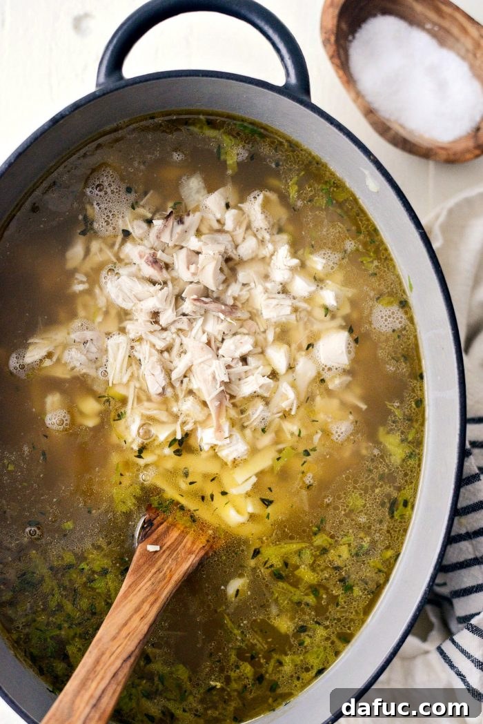 Kluski egg noodles cooking in a separate pot of salted boiling water