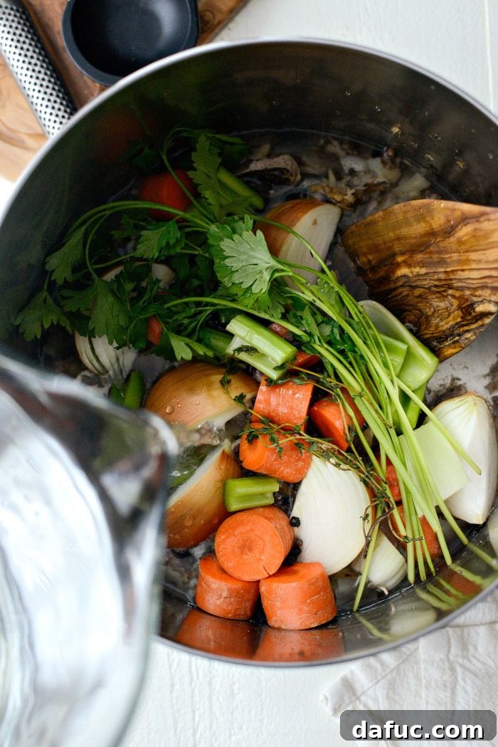 Fresh aromatic vegetables and herbs prepared for chicken stock