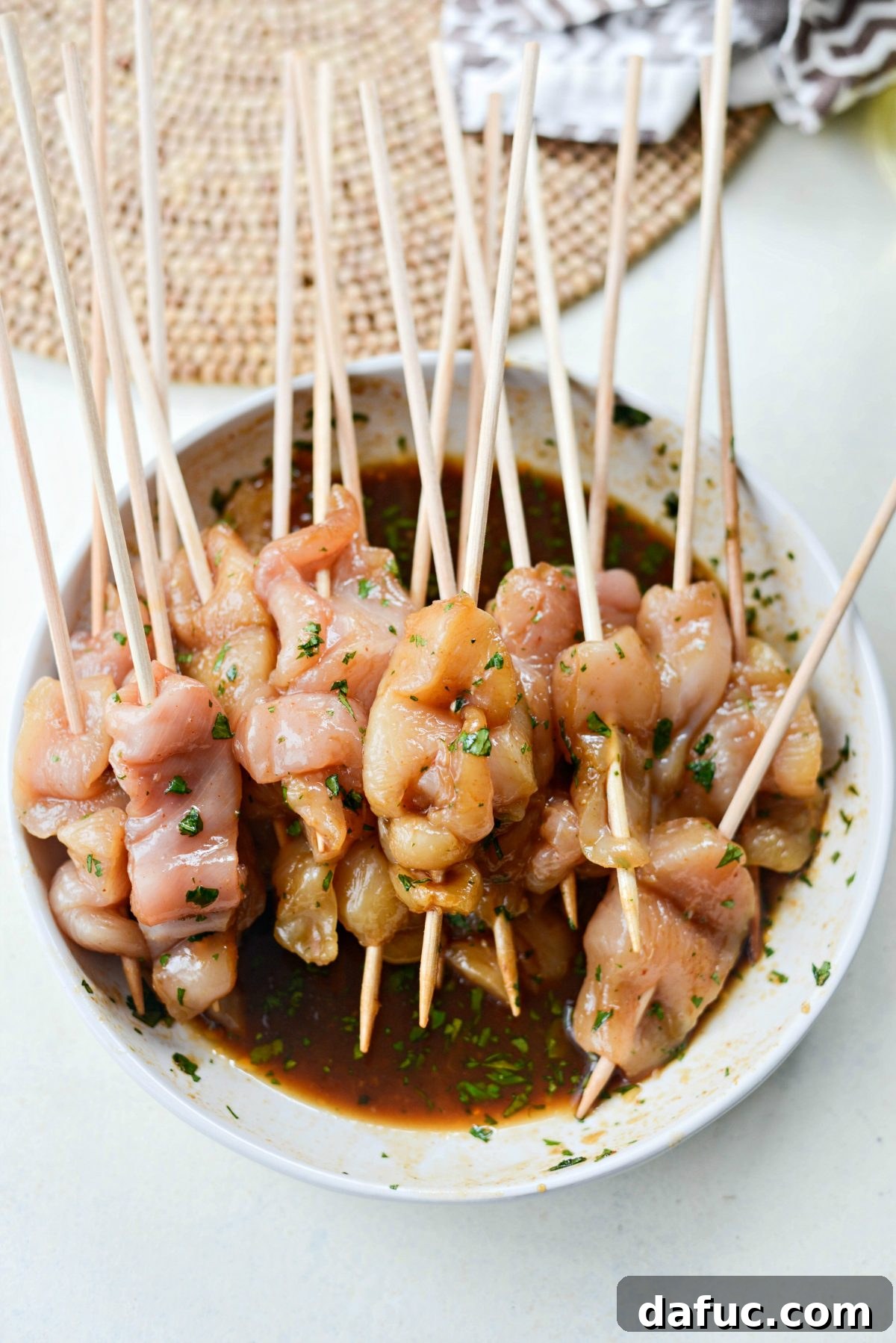 Thai Chicken Satay Skewers with Creamy Peanut Sauce 12 Skewered marinated chicken strips ready for the grill