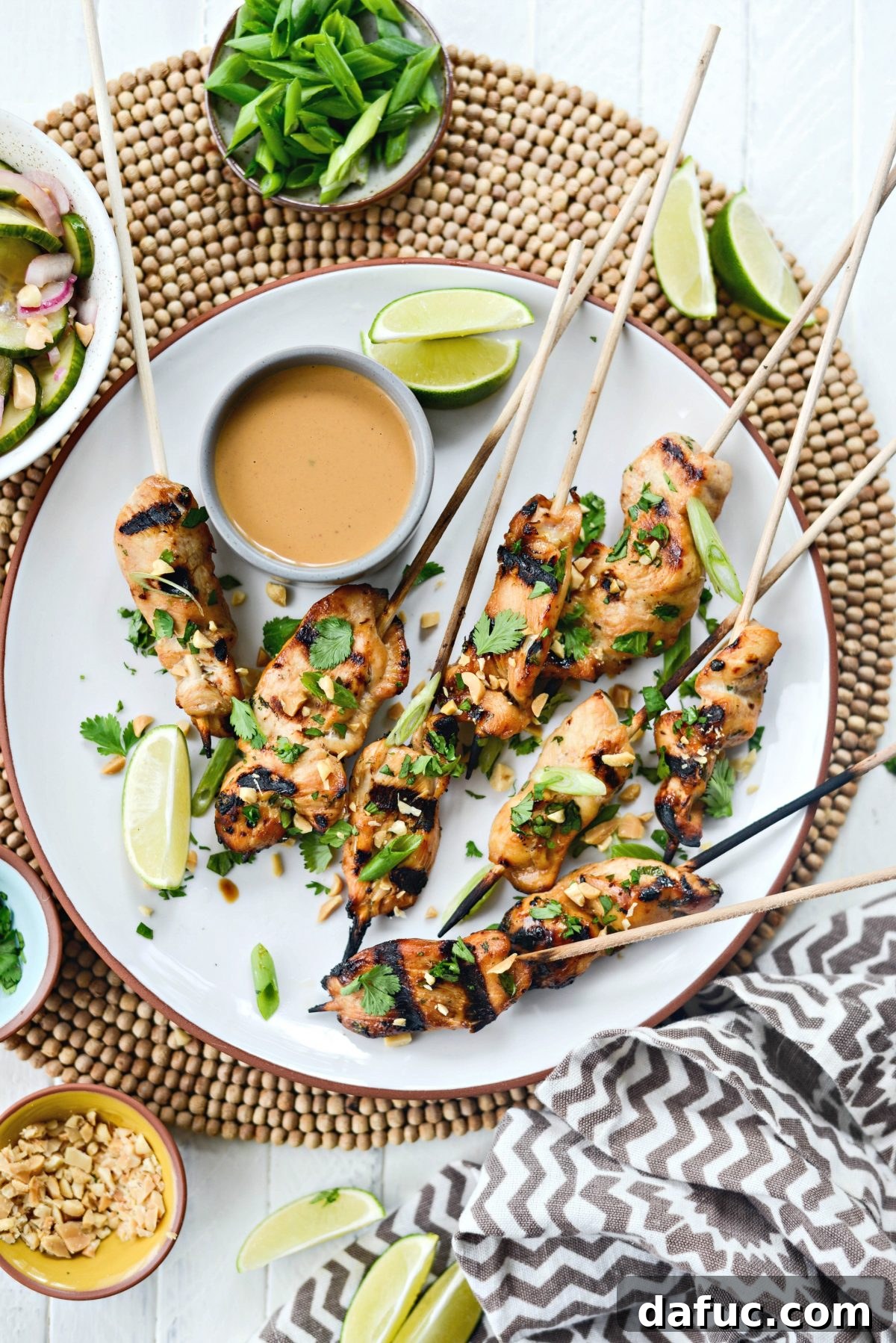 Thai Chicken Satay Skewers with Creamy Peanut Sauce 15 Platter of Chicken Satay with Thai Peanut Sauce garnished with fresh herbs