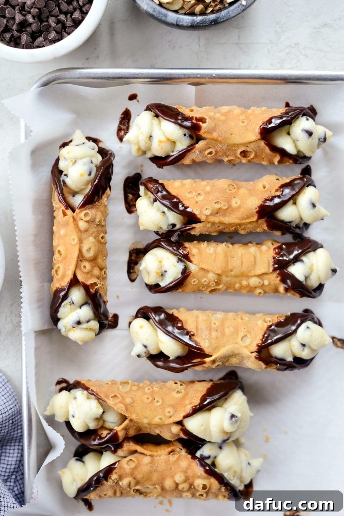 Finished cannolis being garnished.