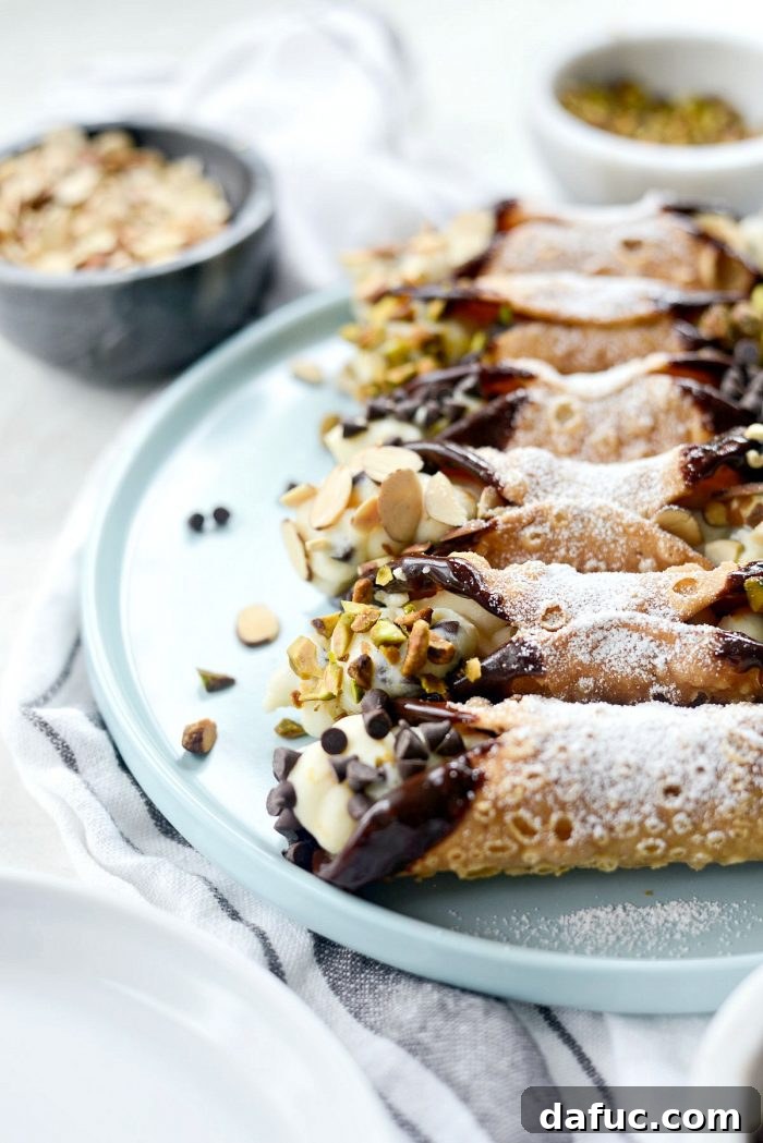 Beautifully arranged tray of Easy Homemade Cannolis, ready for dessert.