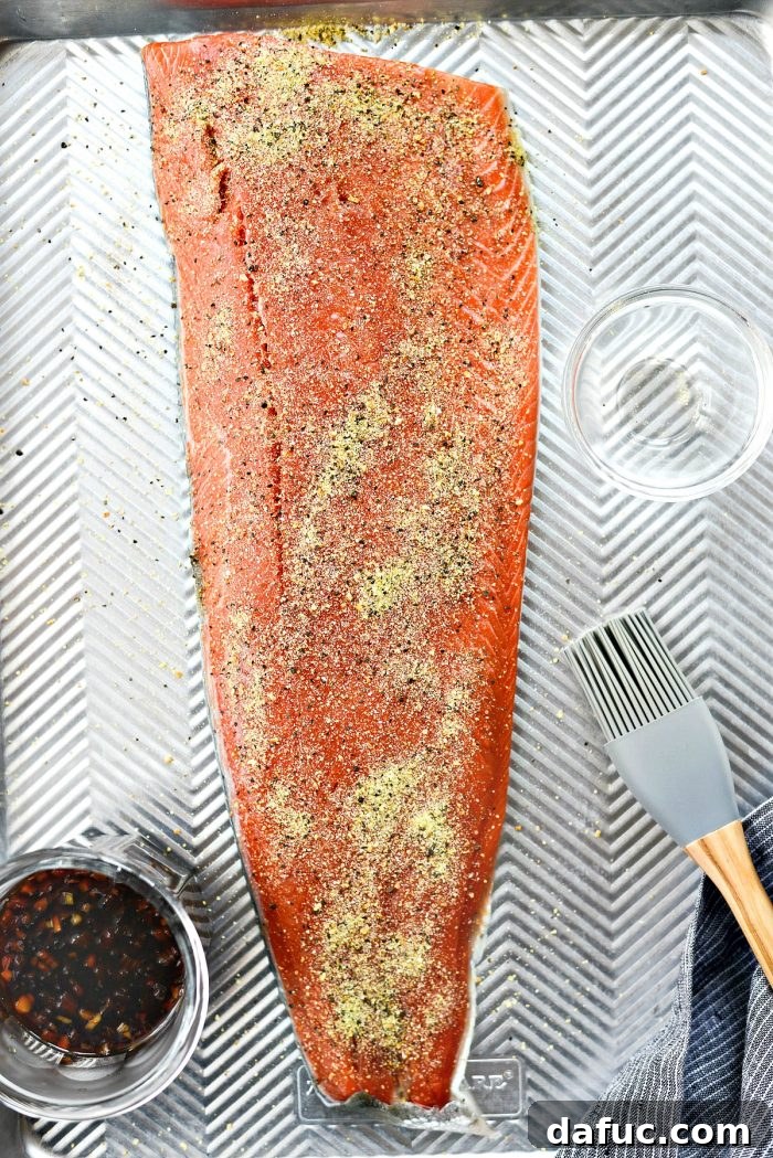 Signature Grilled Whiskey Glazed Cedar Plank Salmon 11 Cedar plank pre-charring on grill grates, upside down
