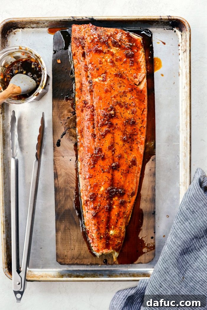 Signature Grilled Whiskey Glazed Cedar Plank Salmon 15 Perfectly grilled whiskey glazed cedar plank salmon on the plank, fresh off the grill