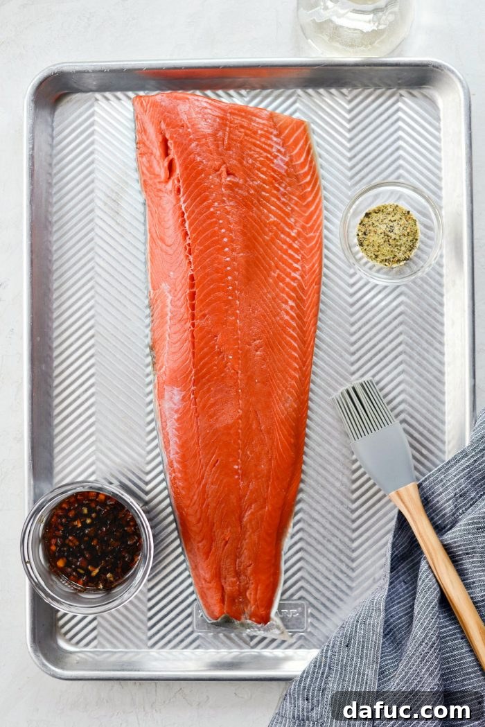 Signature Grilled Whiskey Glazed Cedar Plank Salmon 4 Overhead shot of a full cedar plank salmon fillet after grilling, ready to be served