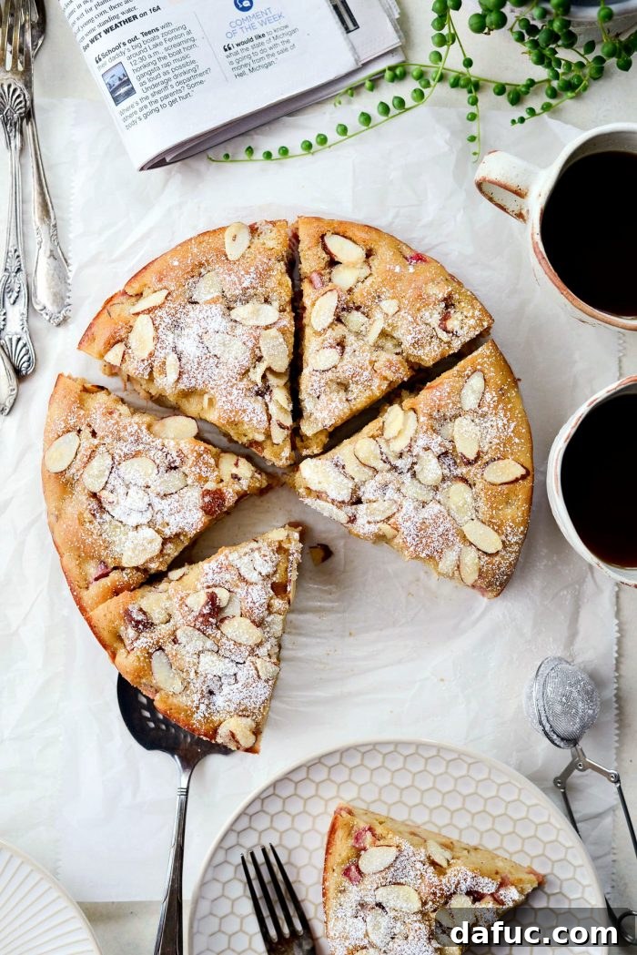 Luscious Rhubarb Almond Bake 2 Moist Rhubarb Almond Cake slices on a plate with fresh rhubarb