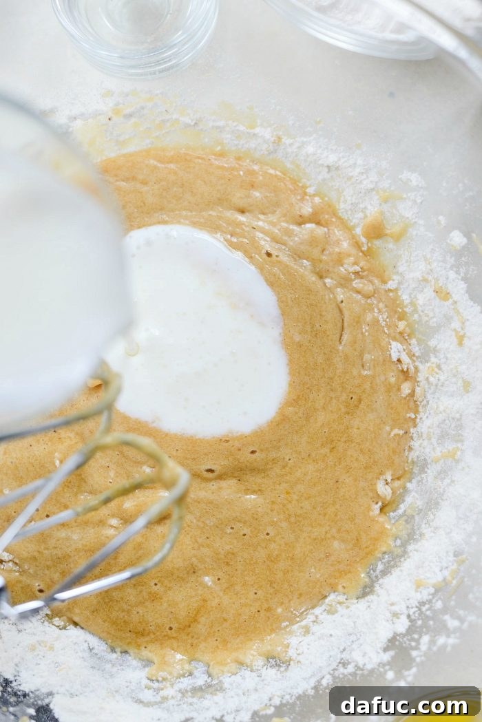 Luscious Rhubarb Almond Bake 11 Mixing cake batter in a bowl