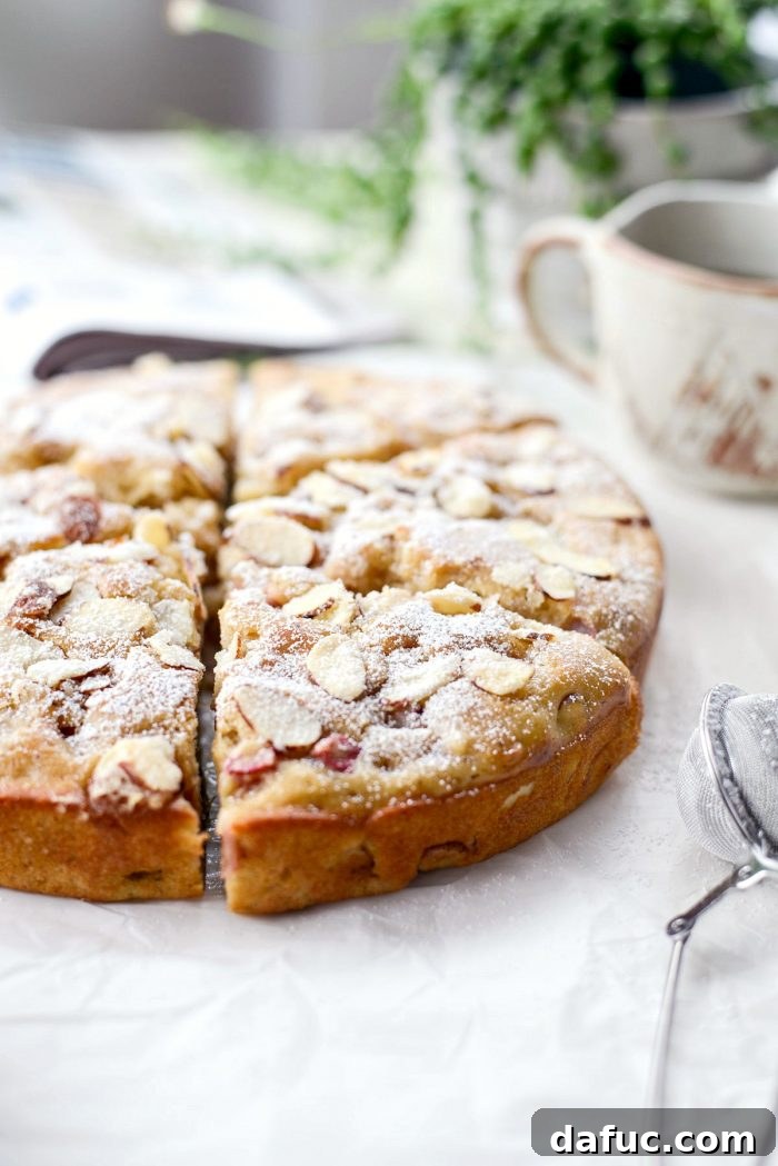 Luscious Rhubarb Almond Bake 23 Slice of Rhubarb Almond Cake with powdered sugar