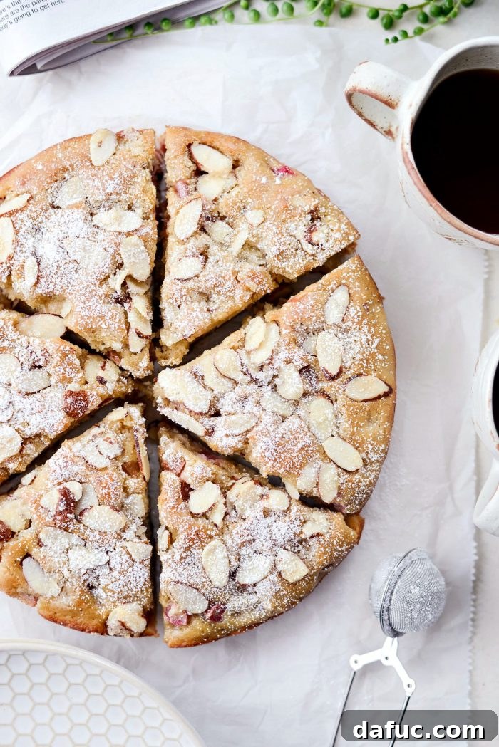 Luscious Rhubarb Almond Bake 24 Rhubarb Almond Cake on a cake stand