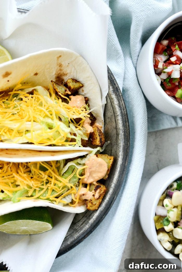 Fiery Potato Tacos with Smoky Chipotle Southwest Sauce 12 Artfully plated spicy potato soft tacos, ready to be eaten