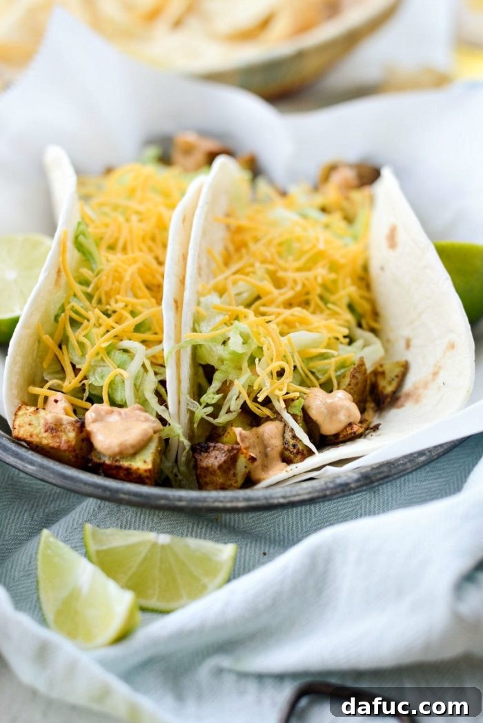 Close-up of a perfectly assembled spicy potato soft taco
