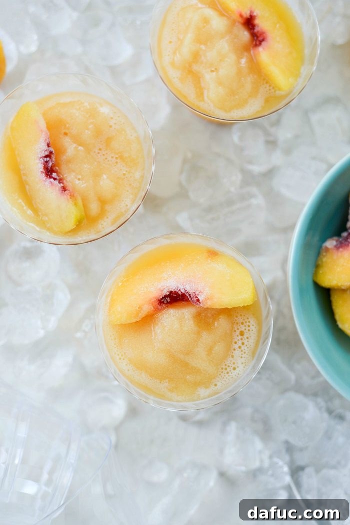 Blushing Peach Dream 2 Cooling Peach Frosé made with rosé wine and frozen peaches – the perfect adult beverage for summer entertaining.
