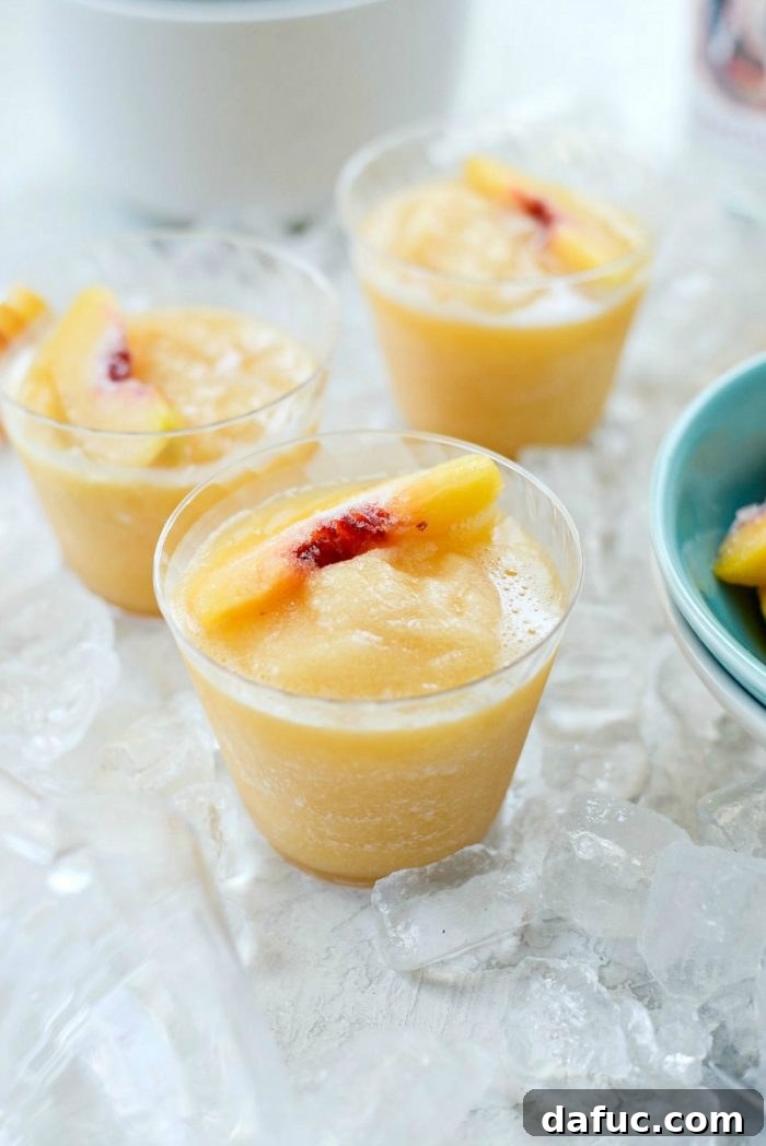 Blushing Peach Dream 3 Refreshing Peach Frosé in glasses, ready to be enjoyed on a hot summer day.