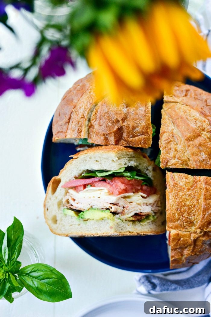 Golden State Club Loaf 17 A final, close-up shot of the sliced California Club Loaf Sandwich, ready to be enjoyed.