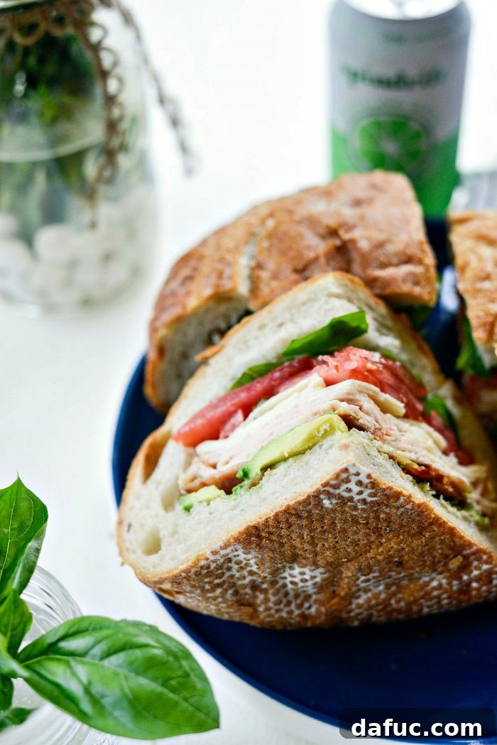 Another beautiful angle of the California Club Loaf Sandwich, emphasizing its fresh ingredients.