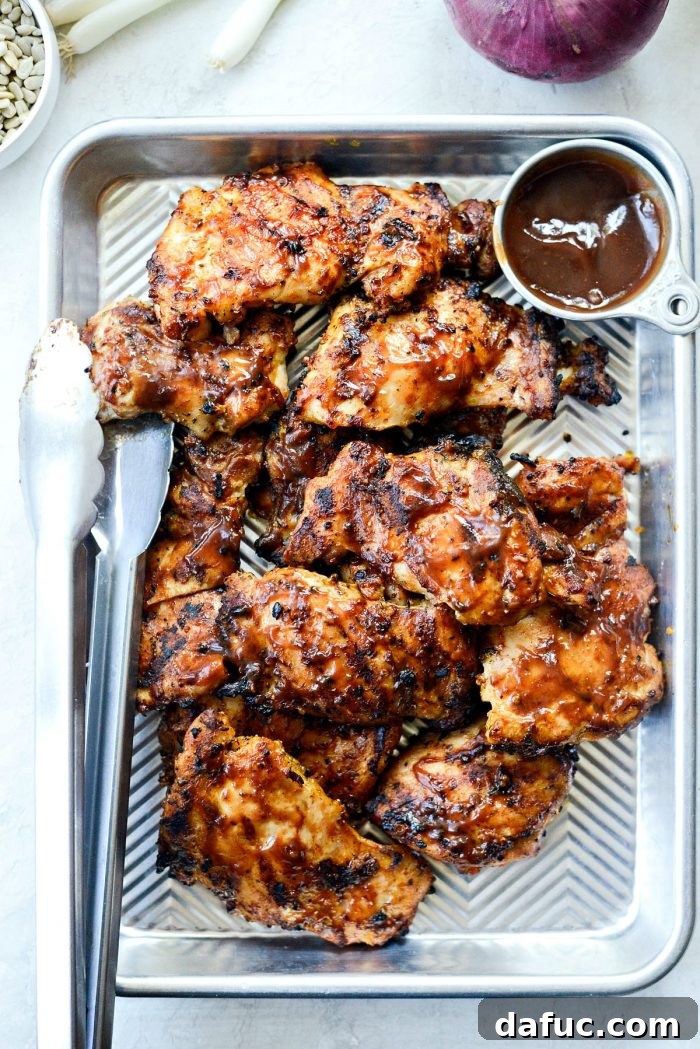Zesty BBQ Chicken Slaw Summer Bowl 7 Seasoned chicken thighs being tossed in a bowl before grilling