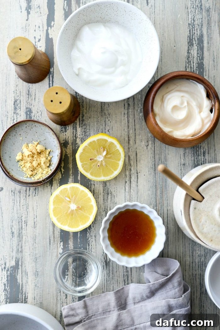 Zesty Greek Yogurt Coleslaw Dressing 3 Ingredients for healthy Greek Yogurt Coleslaw Dressing: yogurt, mayo, lemon, honey, vinegar, dry mustard, celery seed, salt, pepper