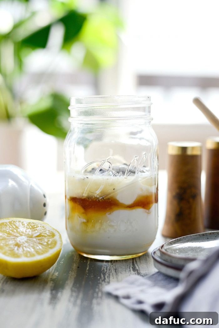 Zesty Greek Yogurt Coleslaw Dressing 4 Mixing Greek yogurt, mayo, lemon juice, honey, vinegar, dry mustard, salt, and pepper for coleslaw dressing