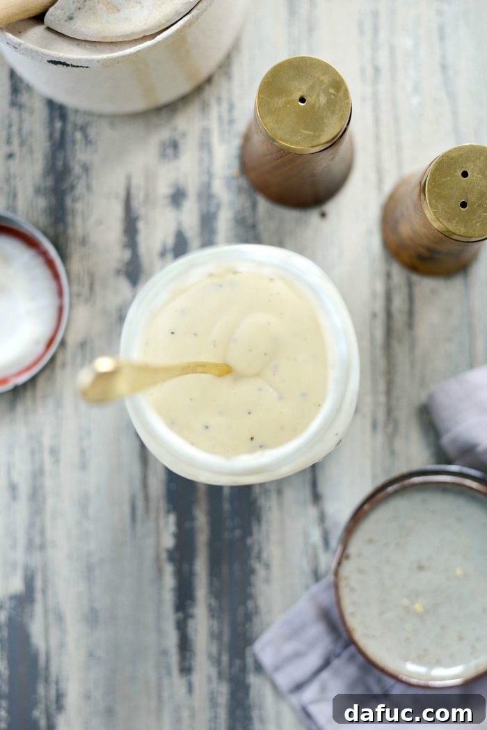 Zesty Greek Yogurt Coleslaw Dressing 8 Close-up of Greek Yogurt Coleslaw Dressing in a mason jar, highlighting its creamy texture