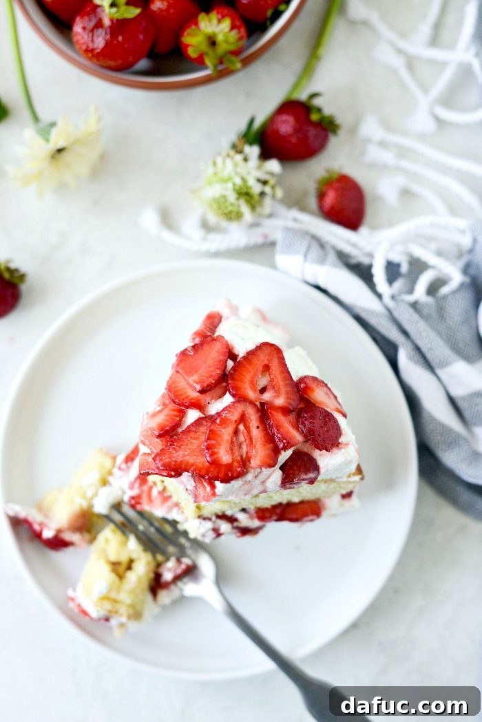 Fresh Strawberry Shortcake 31 Final plated slice of Strawberry Shortcake Cake, showcasing the beautiful layers and fresh fruit.