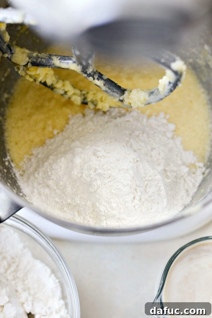 Fresh Strawberry Shortcake 10 Adding eggs one by one to the creamed butter and sugar mixture for pound cake batter.