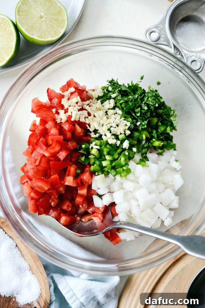 Easy Fresh Salsa 5 Close-up of fresh Roma tomatoes, white onion, garlic, jalapeño, cilantro, and lime – key ingredients for homemade Pico de Gallo. #ingredients #picodegallo #freshproduce