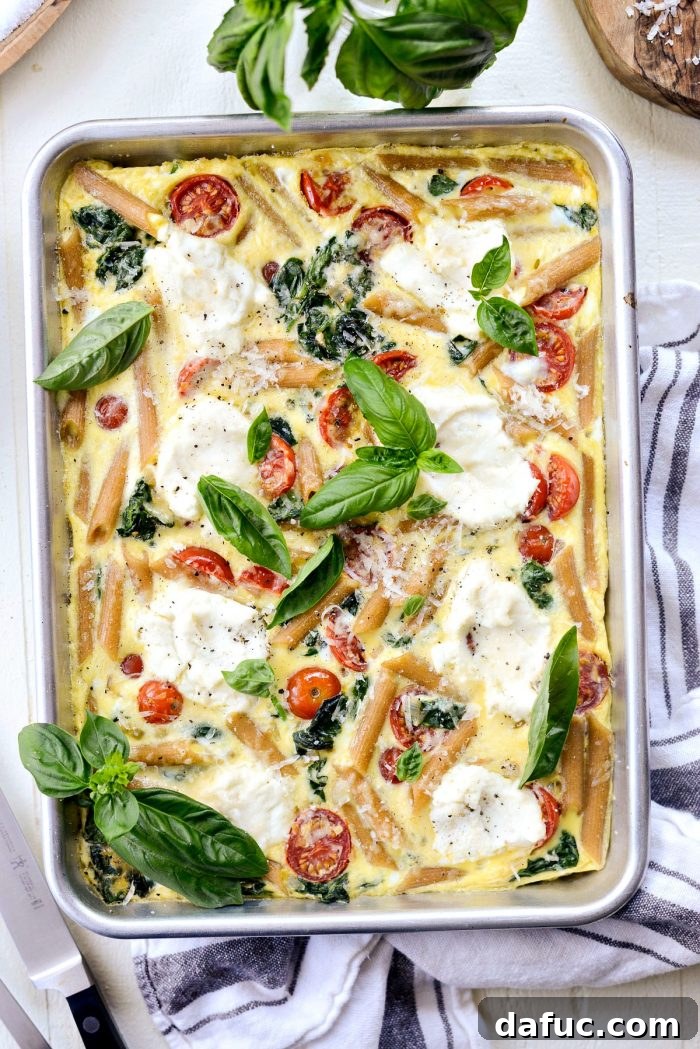 Mediterranean Sheet Pan Pasta Frittata 2 Sheet Pan Spinach Tomato Ricotta Pasta Frittata: A vibrant and easy one-pan breakfast with eggs, spinach, tomatoes, ricotta, and pasta.