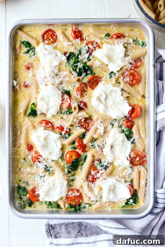 Mediterranean Sheet Pan Pasta Frittata 12 Baked Sheet Pan Spinach Tomato Ricotta Pasta Frittata, ready to be served.