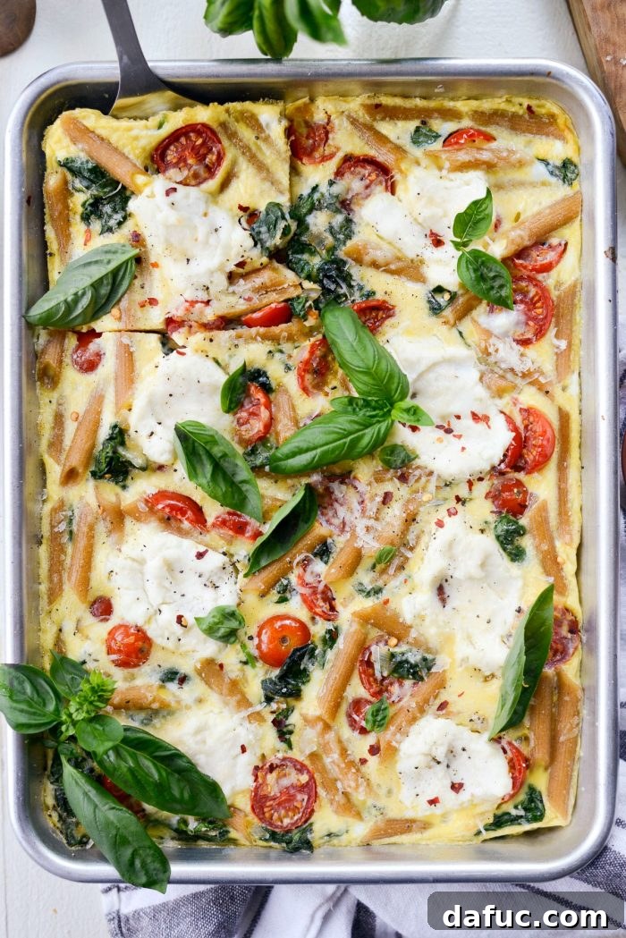 Mediterranean Sheet Pan Pasta Frittata 16 Sheet Pan Spinach Tomato Ricotta Pasta Frittata, a perfect meal prep idea.