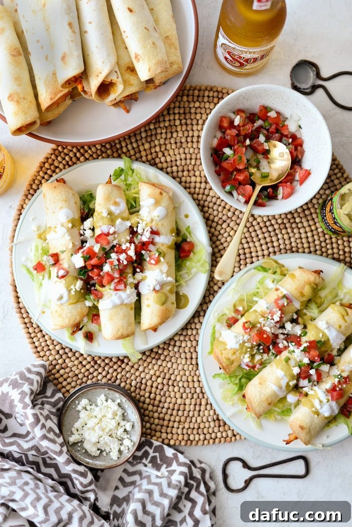 Zesty Air Fryer Salsa Chicken Taquitos 2 Crispy Air Fryer Salsa Chicken Taquitos served on a plate with garnishes