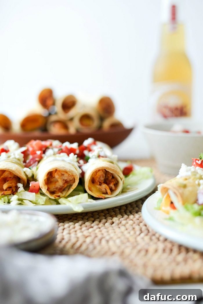 Zesty Air Fryer Salsa Chicken Taquitos 3 Close-up of a batch of Air Fryer Salsa Chicken Taquitos with vibrant colors