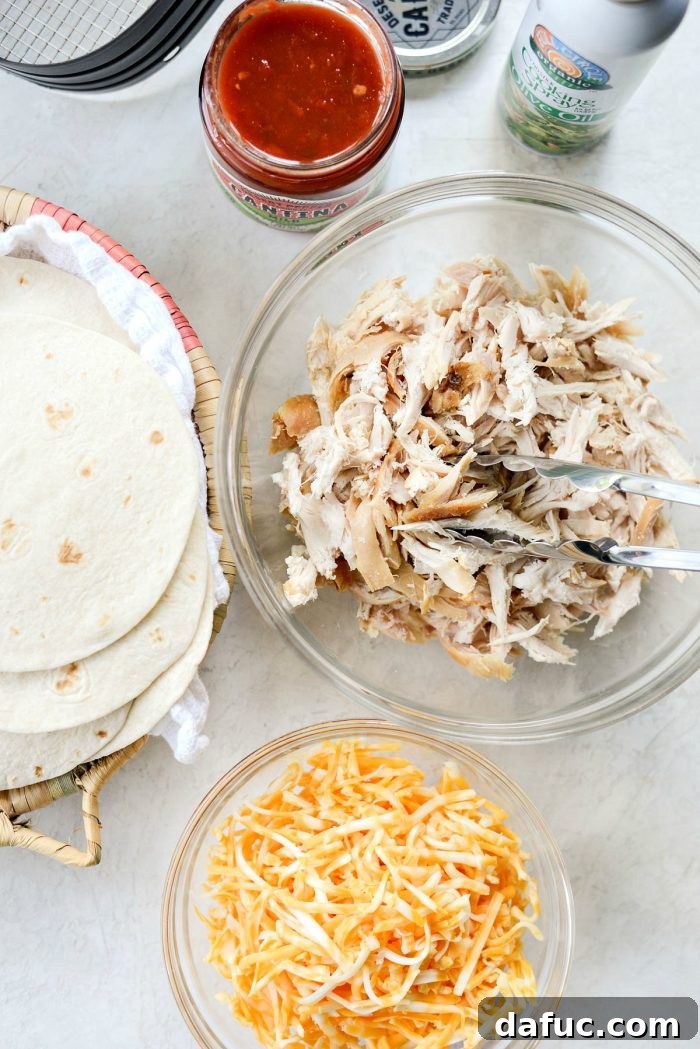 Zesty Air Fryer Salsa Chicken Taquitos 4 Air Fryer Salsa Chicken Taquitos arranged on a serving plate