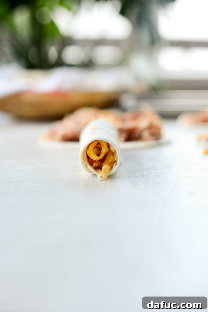 Zesty Air Fryer Salsa Chicken Taquitos 8 Filling soft tortillas with salsa chicken and cheese
