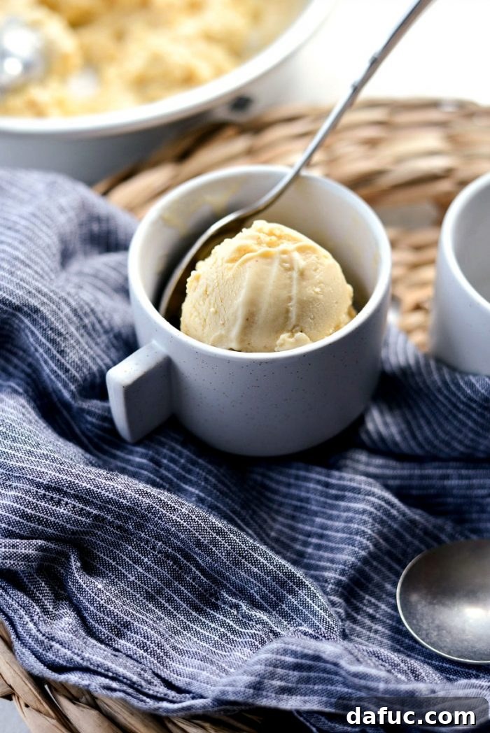 Golden Brown Butter Indulgence 3 Close-up of a perfectly scooped serving of Brown Butter Ice Cream, showing its smooth texture.