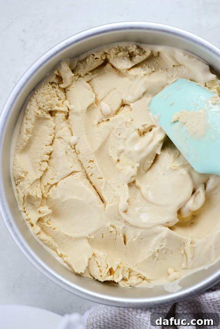 Golden Brown Butter Indulgence 23 Transferring soft-serve consistency brown butter ice cream into a freezer-safe container.