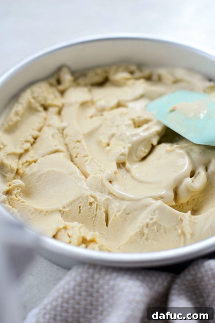 Golden Brown Butter Indulgence 24 Spreading the brown butter ice cream evenly in a container before freezing.