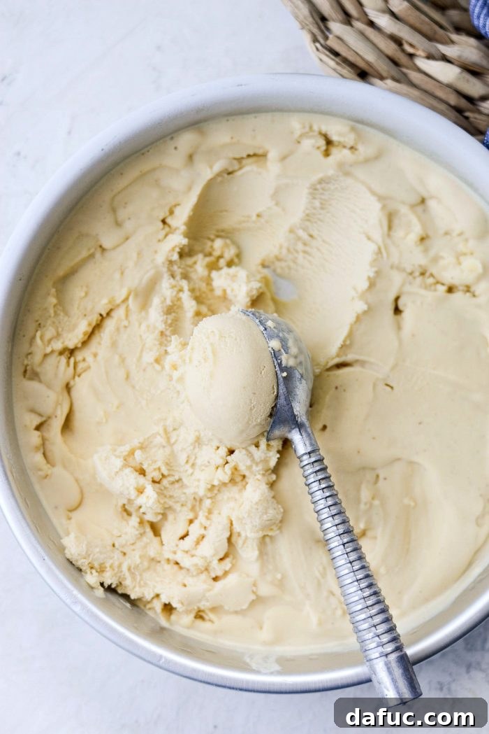 Golden Brown Butter Indulgence 26 Scooping rich and creamy Brown Butter Ice Cream into a bowl.
