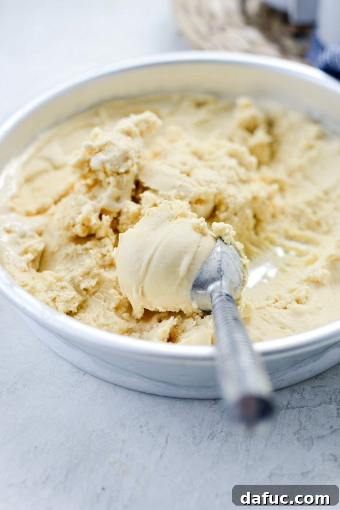 Golden Brown Butter Indulgence 27 Two scoops of homemade Brown Butter Ice Cream in a white bowl.