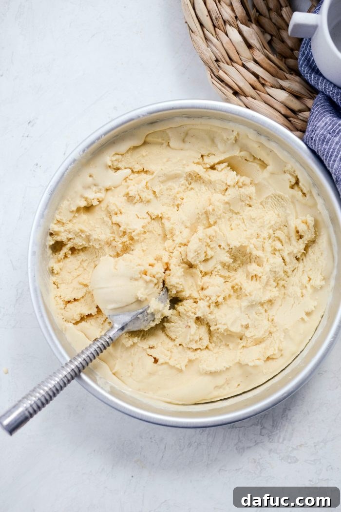 Golden Brown Butter Indulgence 31 A final beautiful shot of a scoop of Brown Butter Ice Cream, glistening and ready to eat.