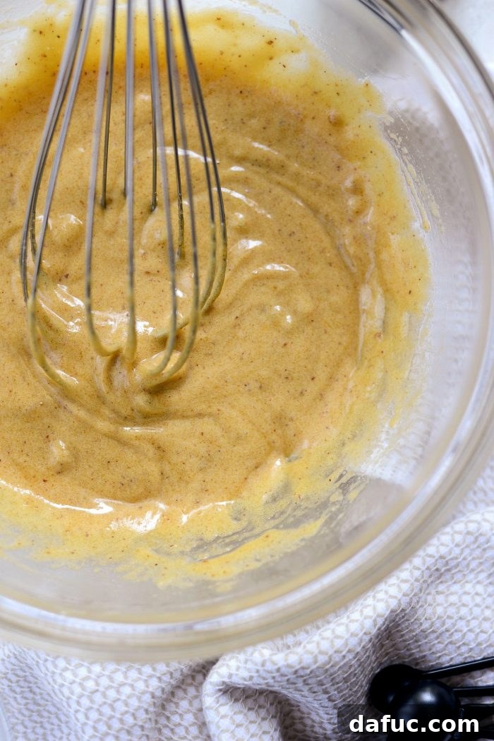 Golden Brown Butter Indulgence 7 Whisking brown butter, egg yolks, and brown sugar until smooth and combined.