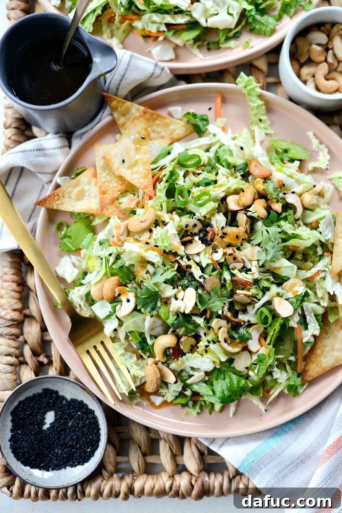 Plated Asian Cabbage Chopped Salad with dressing and wontons